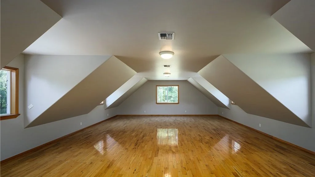 Upstairs room with slanted ceilings and window at 5067 E 26th Dr Bellingham WA 98226