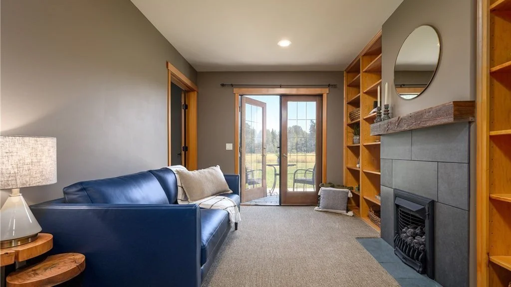 Living room with fireplace and built in bookcases at 5067 E 26th Dr Bellingham WA 98226