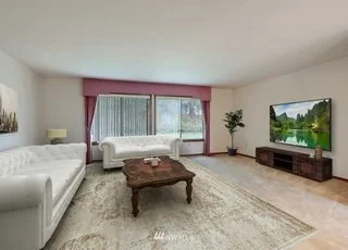 Family room with large windows and hardwood floors at 1300 28th Avenue Court, Milton, WA 98354