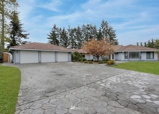 Driveway leading to home and three car garage at 1300 28th Avenue Court
Milton, WA 98354