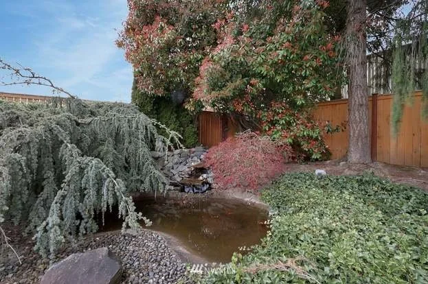 Backyard landscaping with pond at 1300 28th Avenue Court, Milton, WA 98354
