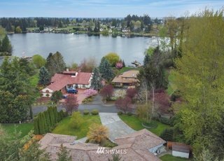 Aerial view of property and nearby lake at 1300 28th Avenue Court, Milton, WA 98354