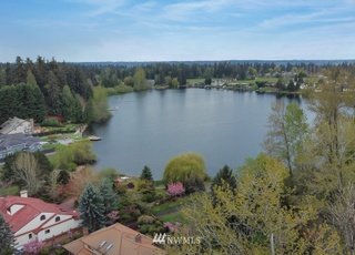 Aerial view of property and nearby lake at 1300 28th Avenue Court, Milton, WA 98354
