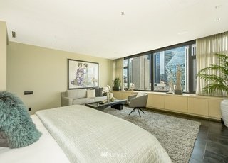 Bedroom with wall to wall windows and granite floors at 715 2nd Ave #1703 Seattle WA 98104