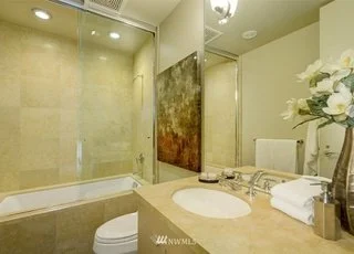 Bathroom with shower/tub combo, toilet and sink at 715 2nd Ave #1703 Seattle WA 98104