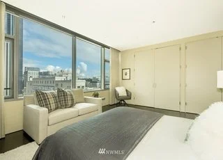 Bedroom with wall to wall window and closets at 715 2nd Ave #1703 Seattle WA 98104