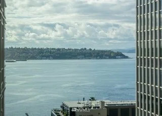 Aerial view of waterfront between buildings at 715 2nd Ave #1703 Seattle WA 98104