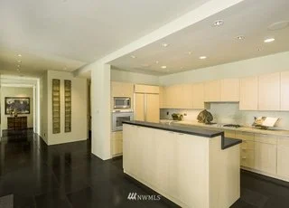 Kitchen with two tiered island and granite floors at 715 2nd Ave #1703 Seattle WA 98104