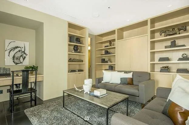 Den area with custom built ins and desk nook at 715 2nd Ave #1703 Seattle WA 98104