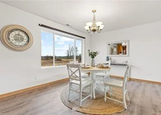 Dining area with large window at 12112 Roosevelt Rd, Snohomish, WA 98290