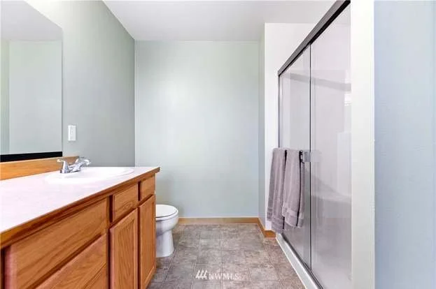 Bathrom with walk-in shower and under counter cupboards at 12112 Roosevelt Rd, Snohomish, WA 98290