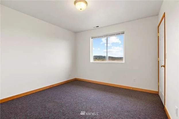 Bedroom with window at 12112 Roosevelt Rd, Snohomish, WA 98290