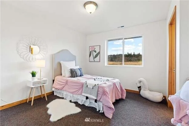 Bedroom with window at 12112 Roosevelt Rd, Snohomish , WA 98290