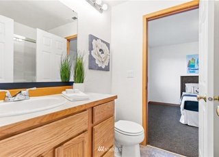 Bathroom leading into bedroom at 12112 Roosevelt Rd, Snohomish, WA 98290