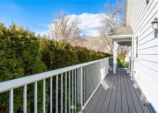 Outside deck and railing running along side of home at 104 Quail Lane Cashmere WA 98815