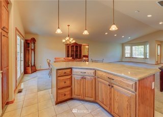 Kitchen island with lower drawers and cupboards at 104 Quail Lane Cashmere WA 98815
