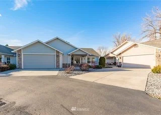 Street and driveway view of 104 Quail Lane Cashmere WA 98815