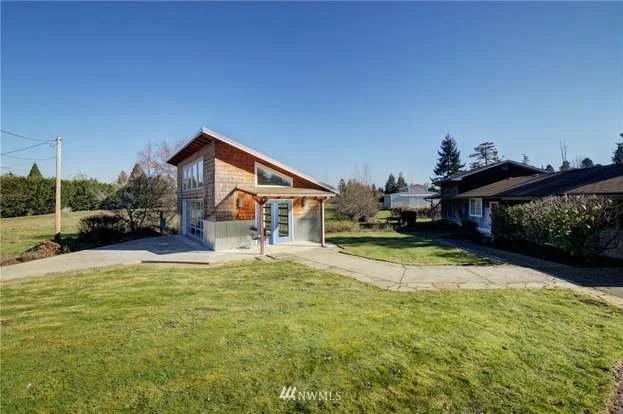 Lawn view of soaking tub building at 2125 118th Ave E Edgewood WA 98372