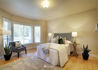Bathroom with bay windows, hardwood floors and sitting area at 2125 118th Ave E Edgewood WA 98372