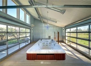 Cabana with hot tub with floor to ceiling windows on two sides at 2125 118th Ave E Edgewood WA 98372