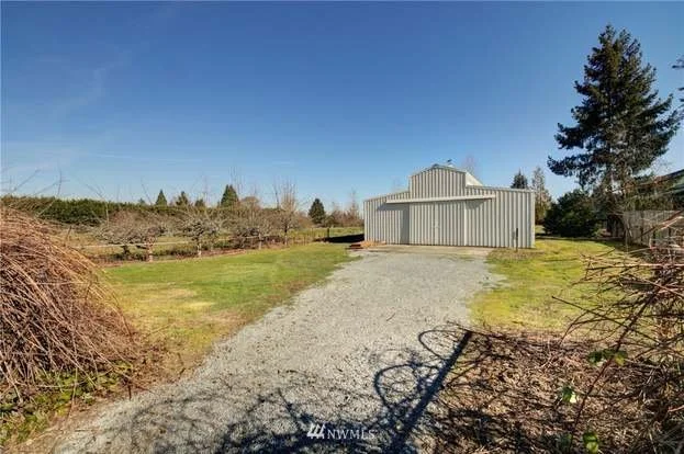 Gravel road leading to garage/workshop building at 2125 118th Ave E Edgewood WA 98372
