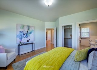 Bedroom with attached bathroom and shelved closet at 2125 118th Ave E Edgewood WA 98372