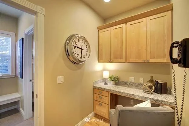 Office nook with granite work area, upper cabinets and lower drawers at 2125 118the Ave E Edgewood WA 98372