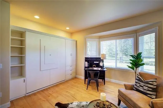 Den with bay windows, hardwood floors and built in murphy bed at 2125 118th Ave E Edgewood WA 98372