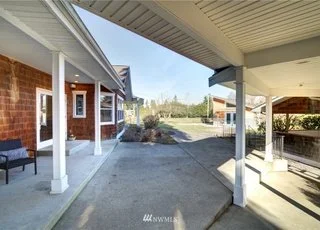 Covered outside seating area with concrete patio at 2125 118th Ave E Edgewood WA 98372