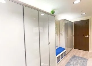 Entryway with built in closets and bench at 820 Blanchard St #810 Seattle WA 98121