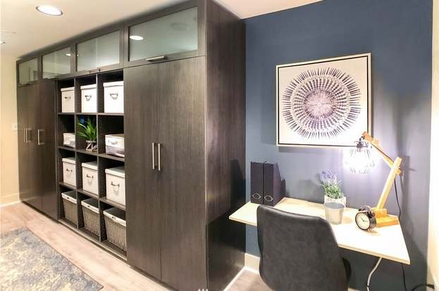 Office area with desk nook and built in storage at 820 Blanchard St #810 Seattle WA 98121