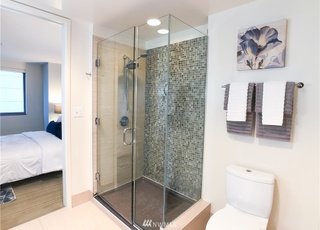 Bathroom corner shower with double shower heads at 820 Blanchard St #810 Seattle WA 98121