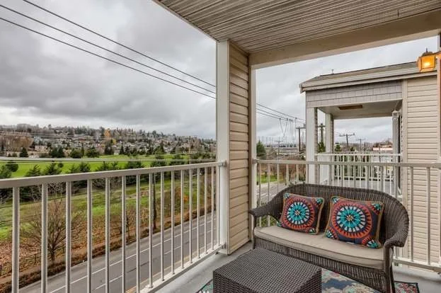 Balcony view of street and green belt at 2530 15th Ave W #508 Seattle WA 98119
