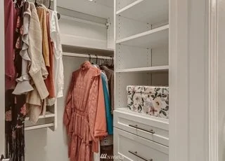 Walk in closet with built in rods, shelves and drawers at 2530 15th Ave W #508 Seattle WA 98119