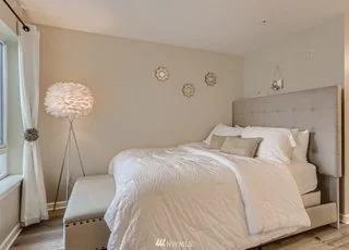 Bedroom with natural lighting from large window at 2530 15th Ave W #508 Seattle WA 98119