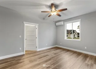 Bedroom with window and ceiling fan at 112 Skyhawk Dr Toledo WA 98591