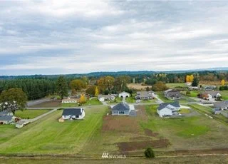 Aerial view of home and surrounding properties at 112 Skyhawk Dr Toledo WA 98591