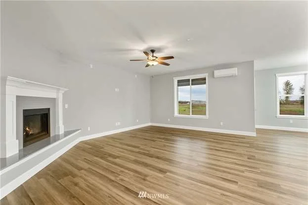 Livingroom with fireplace and ceiling fan at 112 Skyhawk Dr Toledo WA 98591