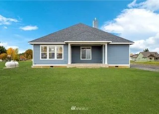 Lawn back view of home at 112 Skyhawk Dr WA 98591