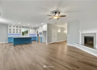 Livingroom with fireplace and ceiling fan at 112 Skyhawk Dr Toledo WA 98591