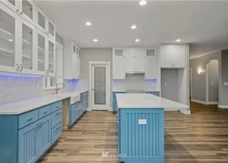 Kitchen with hardwood flooring, cabinets and island at 112 Skyhawk Dr Toledo WA 98591