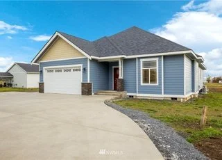Driveway and front view of home at 112 Skyhawk Dr Toledo WA 98591