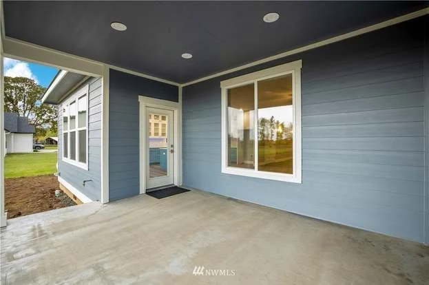 Back covered patio with lights at 112 Skyhawk Dr Toledo WA 98591