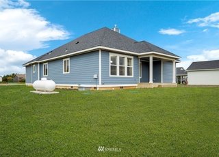 Lawn, sideview of home at 112 Skyhawk Dr Toledo WA 98591