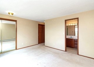 Bedroom with attached bathroom and large closets at 21700 Calhoun Road Monroe, WA 98272