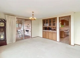 Dining area next to kitchen entrance and sliding doors at 21700 Calhoun Road Monroe, WA 98272