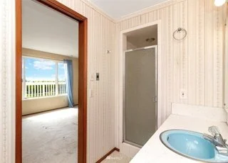 Attached bathroom wit shower and single sink vanity at 21700 Calhoun Road Monroe, WA 98272