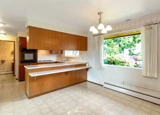 Casual dining area with kitchen counter seating, windows and tiled flooring at 21700 Calhoun Road Monroe, WA 98272