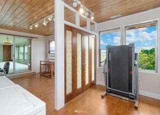 Utility area with vie21700 Calhoun Road Monroe, WA 98272ws and entrance into sun room at 