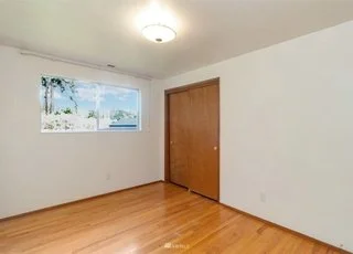 Bedroom with hardwood floors, windows and closet at 21700 Calhoun Road Monroe, WA 98272